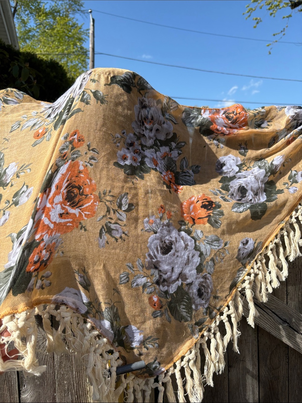 Indigo Soul floral triangular scarf with tassels.